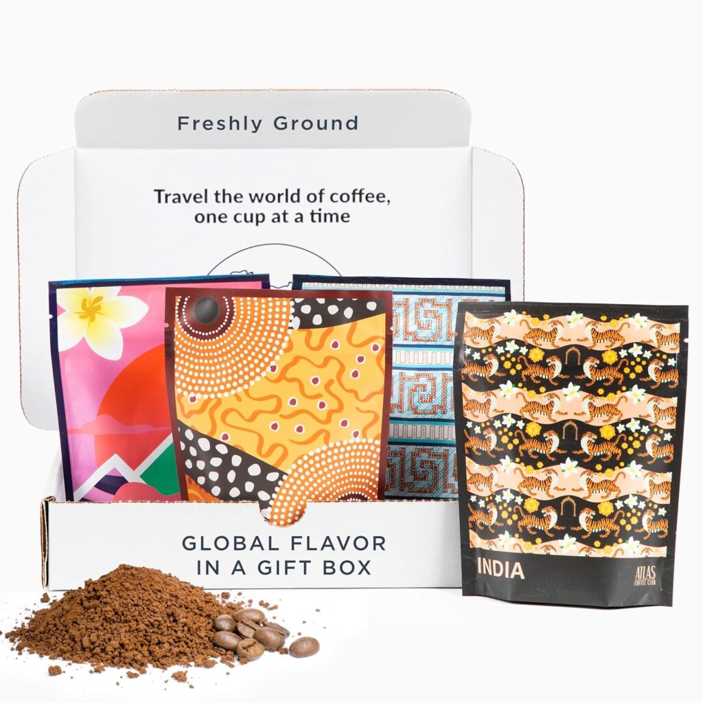 Atlas Coffee Club coffee gift basket with 8-pack variety of single-origin ground coffees, featuring global flavors and postcard-style packaging.