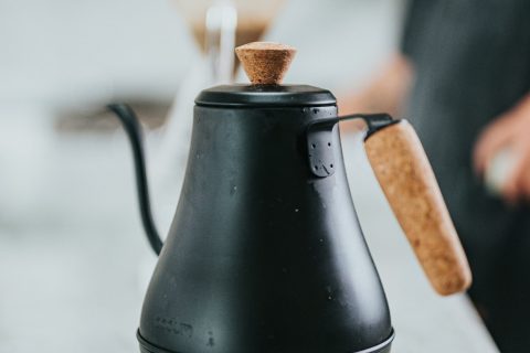 Pour-over coffee brewing with kettle and dripper